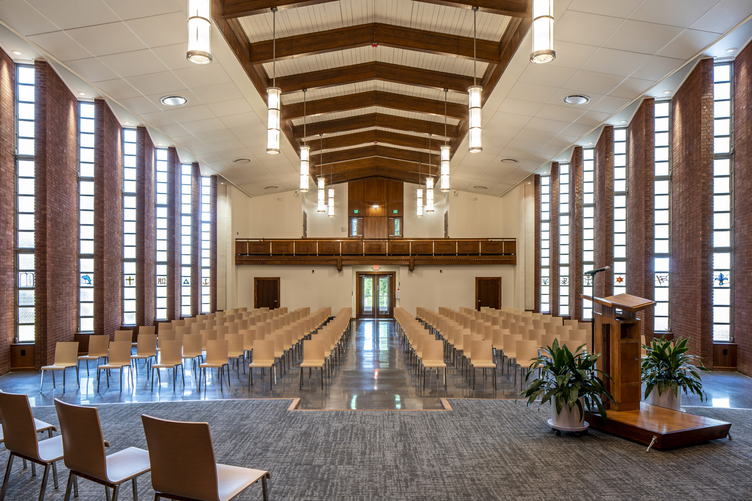 Greg Poole, Jr. All Faiths Chapel Chancel Looking into Nave with Seats and Hanging Lights