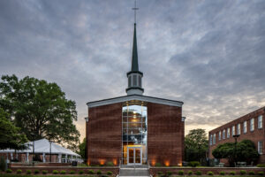 Greg Poole, Jr. All Faiths Chapel Front Exterior at Dusk with Lights