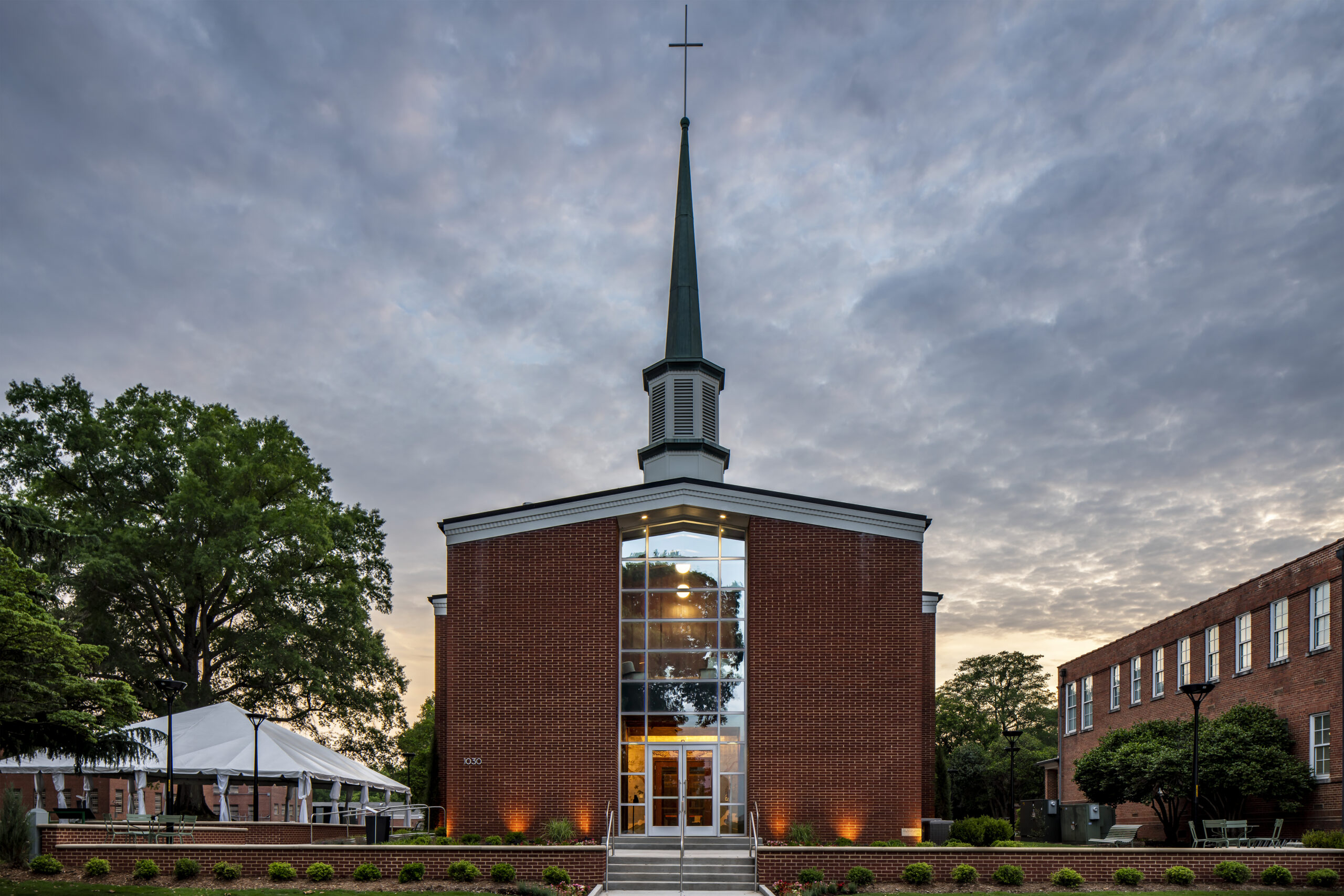 Greg Poole, Jr. All Faiths Chapel Front Exterior at Dusk with Lights
