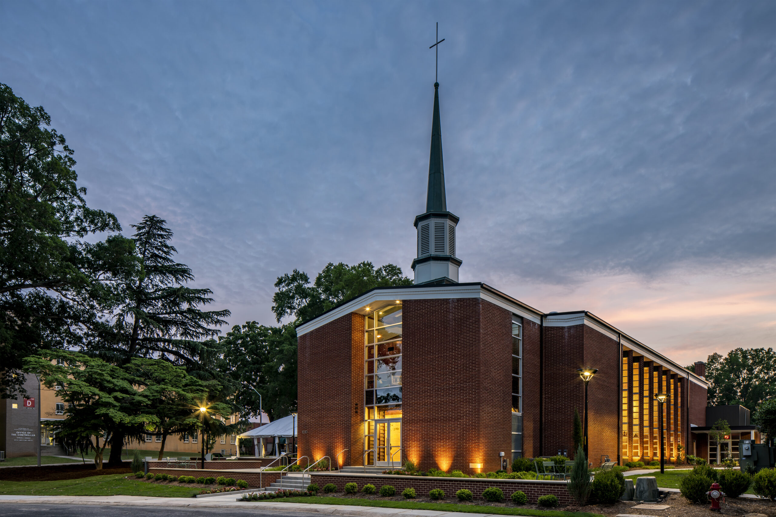 Greg Poole, Jr. All Faiths Chapel Front Exterior Side View at Dusk with Lights