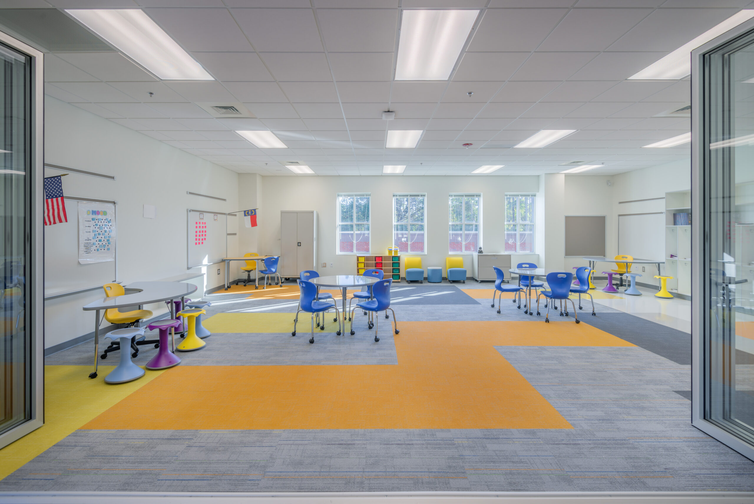 Barton Pond Elementary School Flex Space and Classroom with Whiteboards, Collaborative Work Spaces, and Transparent Accordion Room Dividers