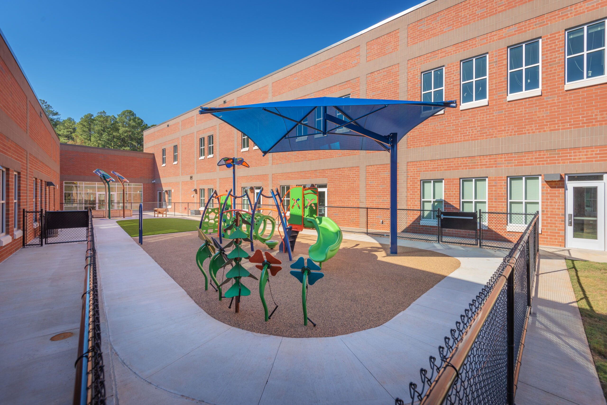 Barton Pond Elementary School Small Playground with Canopy and Green Play Equipment