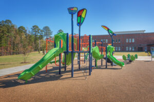 Barton Pond Elementary School Larger Playground Equipment with Green Slide and Orange Monkey Bars