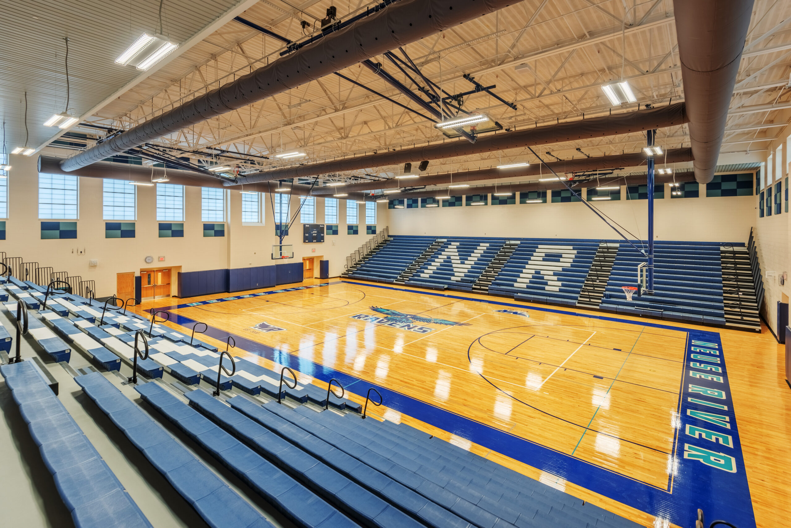 Neuse River Middle School Main Gym with Bleachers around Basketball Court