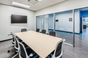 College of the Albemarle Dare County Campus Meeting Room with Mounted TV, Window Walls, and Conference Room Table