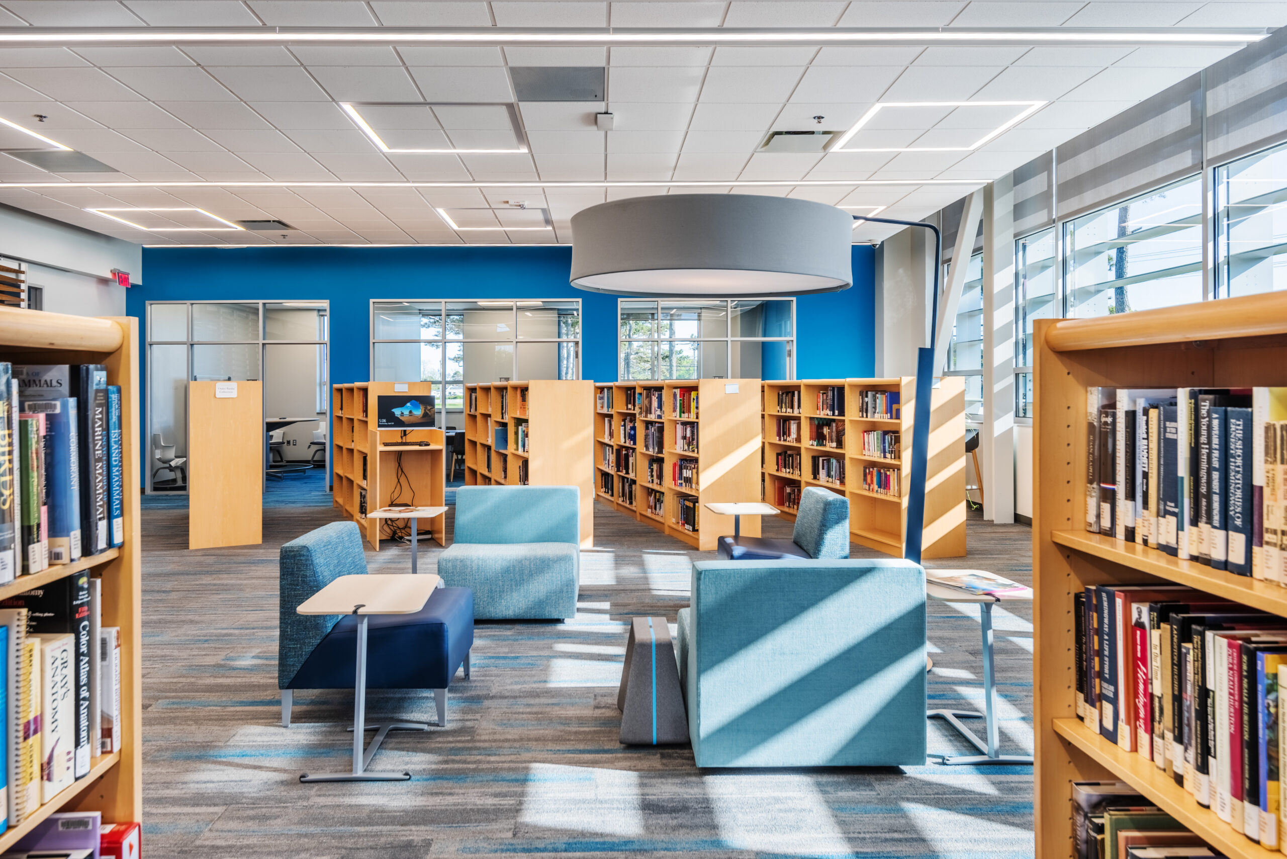 College of the Albemarle Dare County Campus Library with Full Bookshelves and Blue Couches