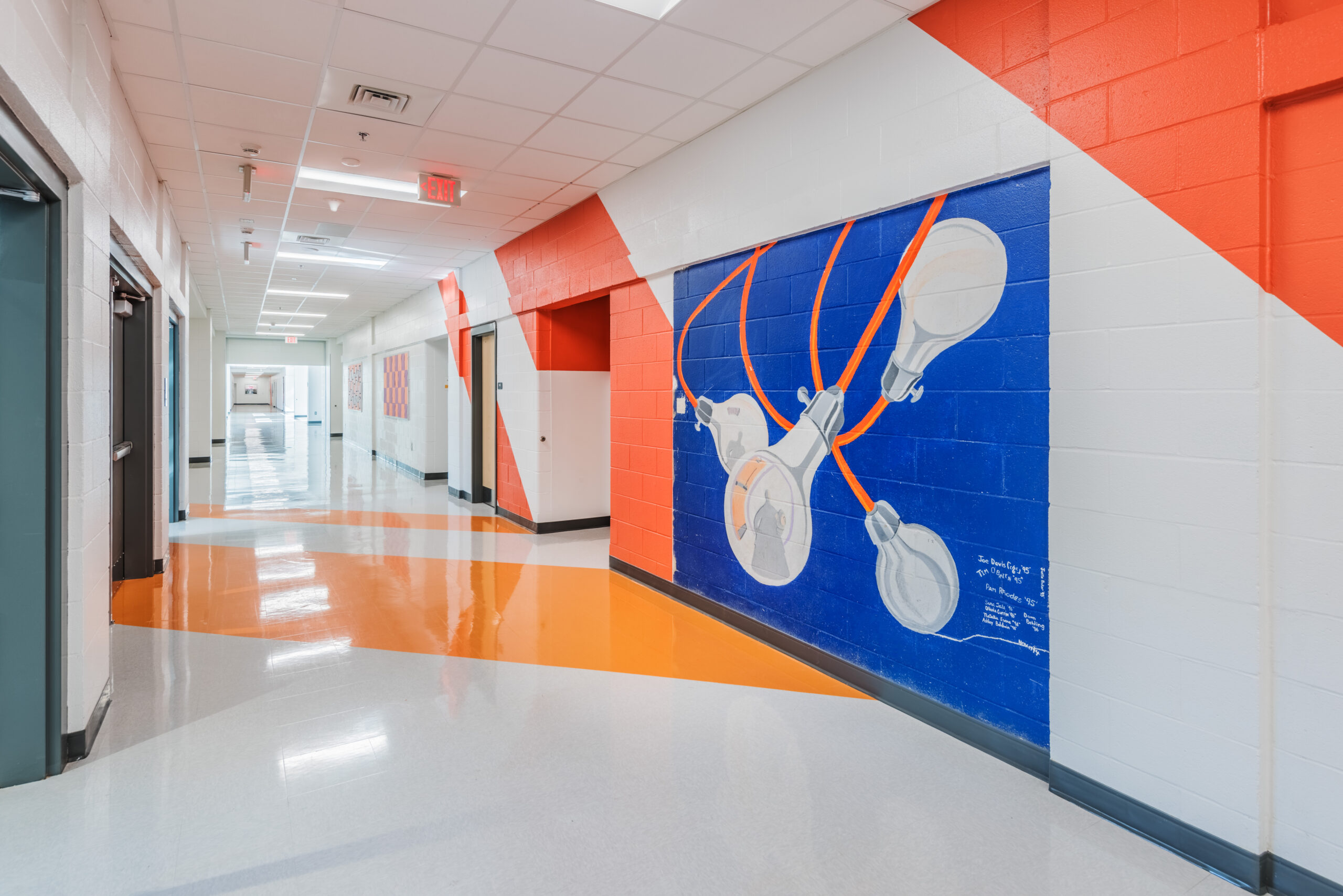 Fuquay-Varina High School Hallway Painted Mural with Edison Lights Swinging on a Blue Background