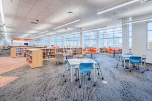 Fuquay-Varina High School Library Open Seating Areas Surrounded by Full, Half-Height Book Shelves
