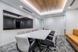 Conference Room with Large TV and Wood Paneled Wall