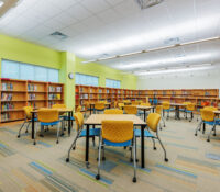Media Center with Books, Tables, and Chairs