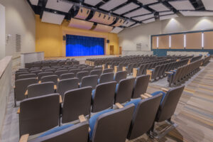 Auditorium Seating and Stage with Blue Curtains