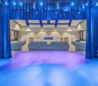 Auditorium Stage with Blue Curtains