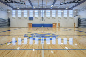 Main Gym Basketball Court with Logo in Middle of Floor